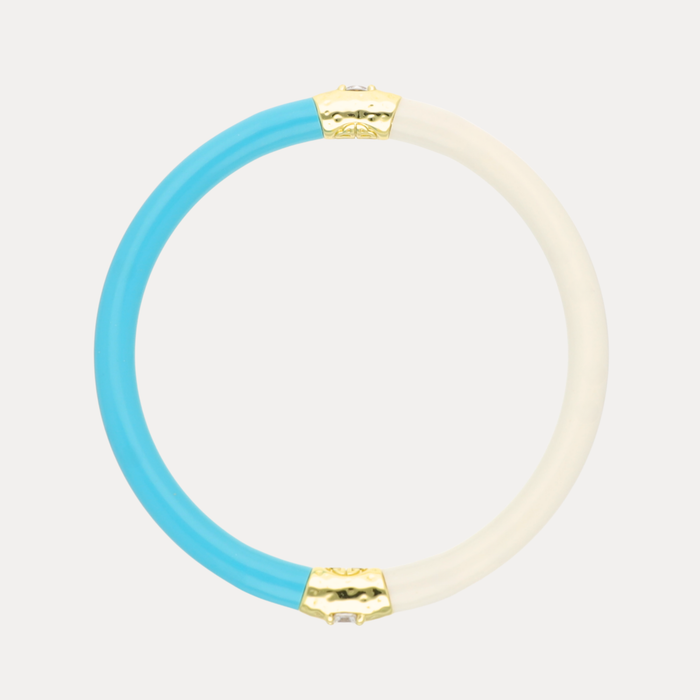 a blue and white circle with gold details