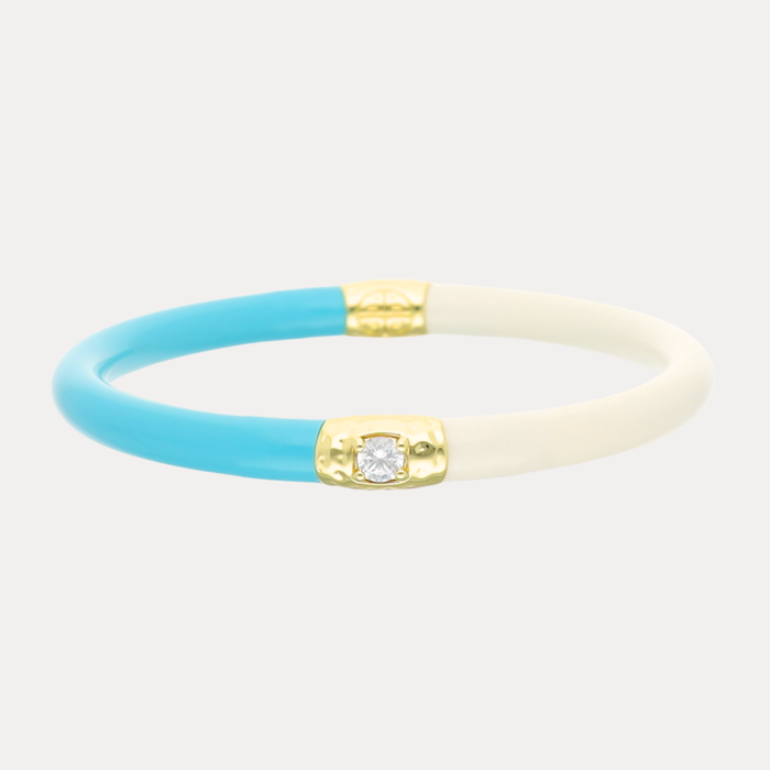 a blue and white bracelet with a diamond in the middle